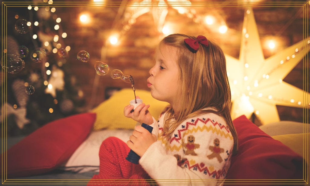 girl blowing bubbles