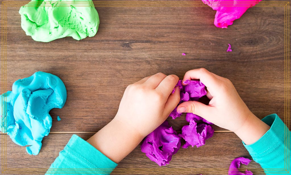 kid playing playdough