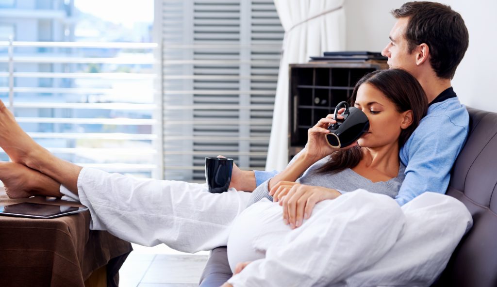 couple-relaxing-in-pajammas-drinking-coffee